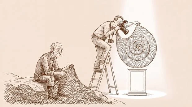 An older man mending nets beside a photographer on a ladder framing a shell under a spotlight